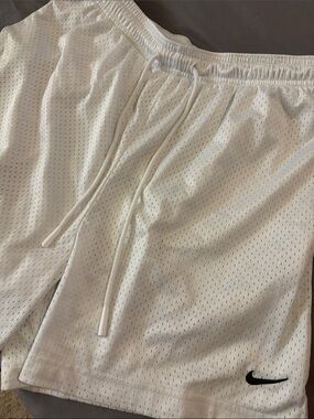 Nike White Mesh Athletic Shorts with Black Swoosh